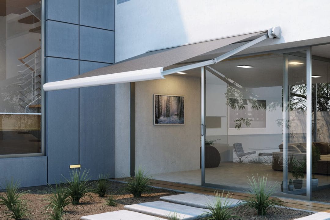 Glass-walled patio with extended sunshade