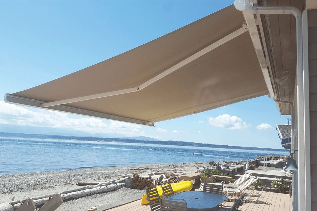 Retractable awning over seaside deck