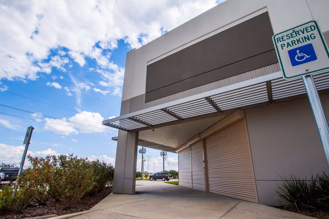 Modern building with reserved parking sign