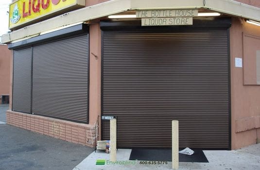 Liquor store entrance secured with shutters