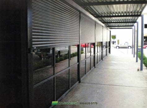 Covered walkway with metal shutters