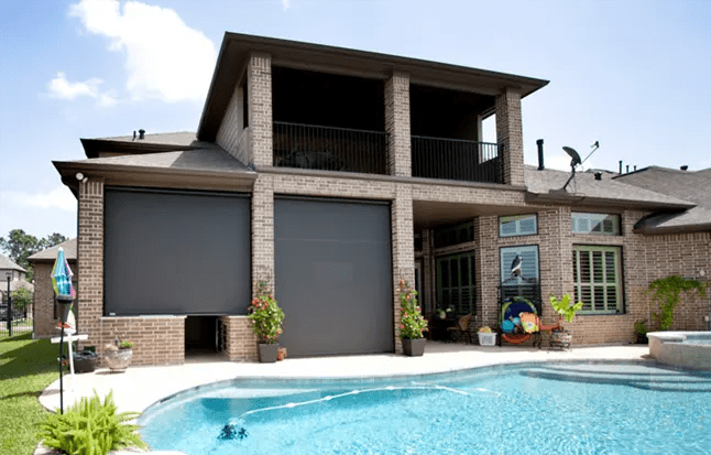 Brick home with outdoor pool area
