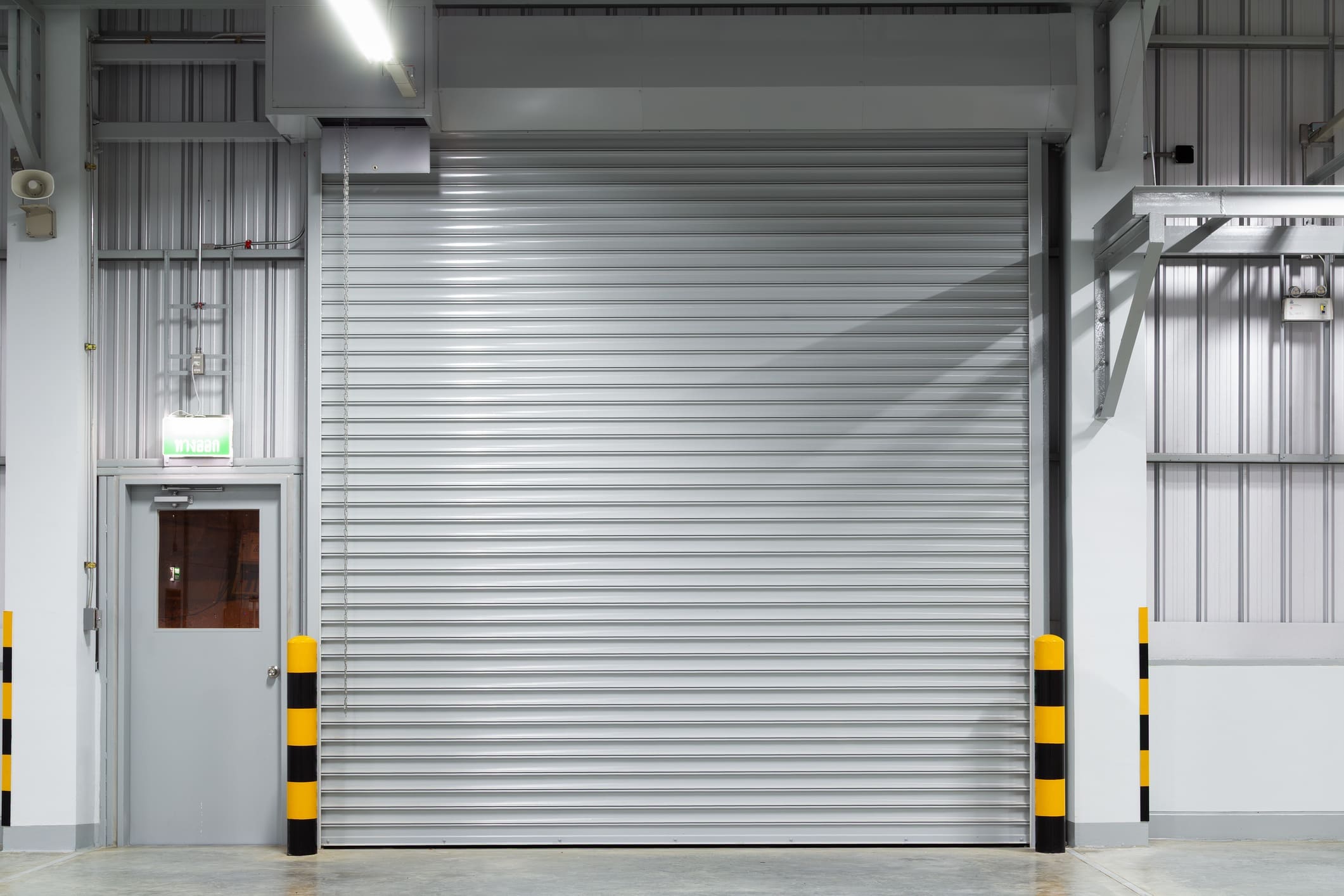 Industrial garage door in a warehouse setting.