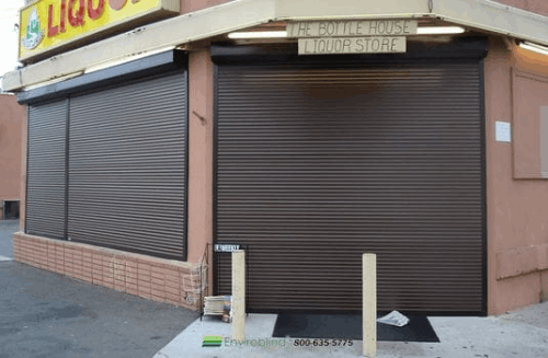 Liquor store entrance secured with shutters