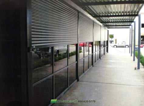Covered walkway with metal shutters