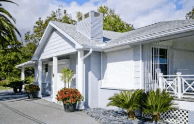 White bungalow with garden